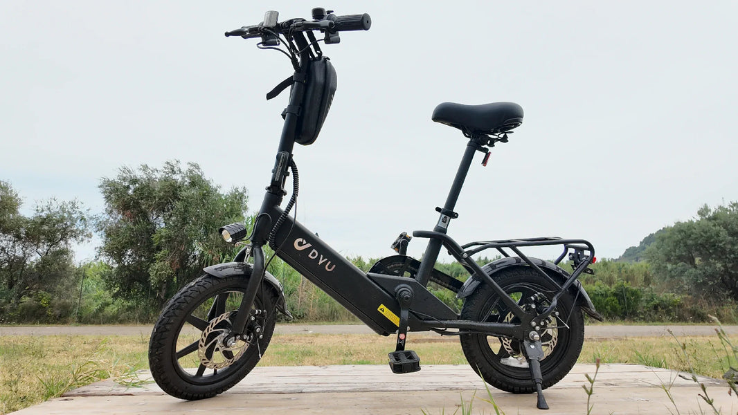 DYU C3 first e-bike ride checklist with folding bike parked by a wooden dock
