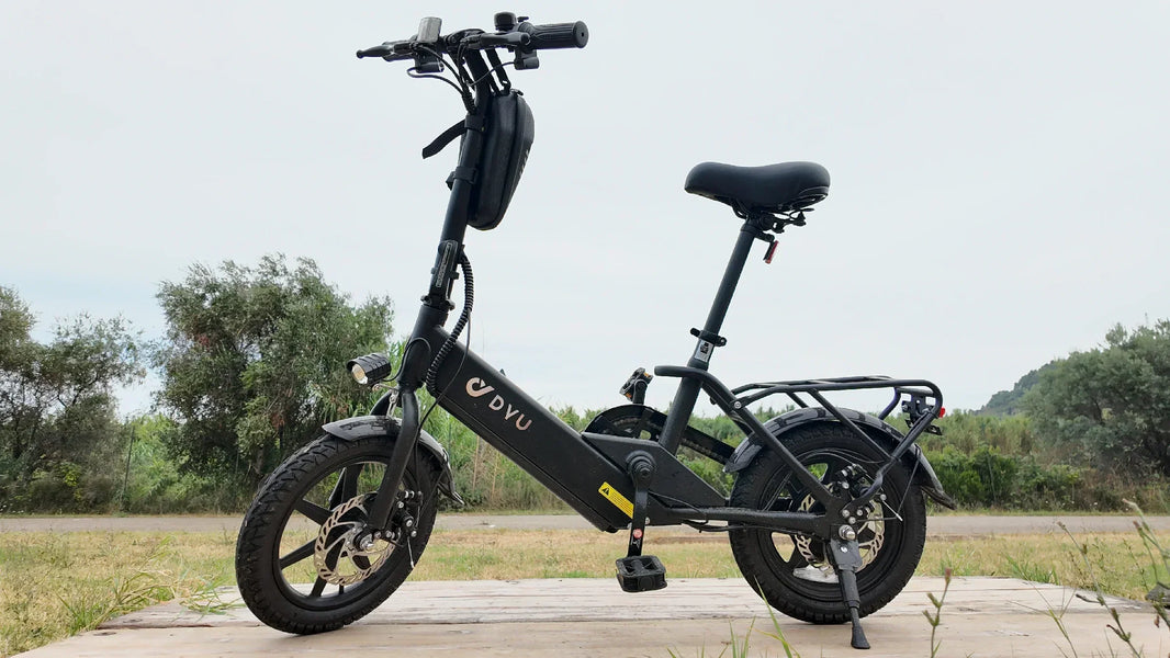 DYU C3 first e-bike ride checklist with folding bike parked by a wooden dock