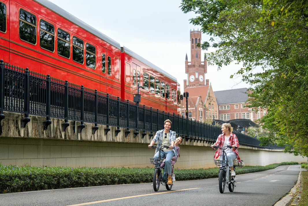 DYU C9 e-bike near a train crossing route for night riding planning