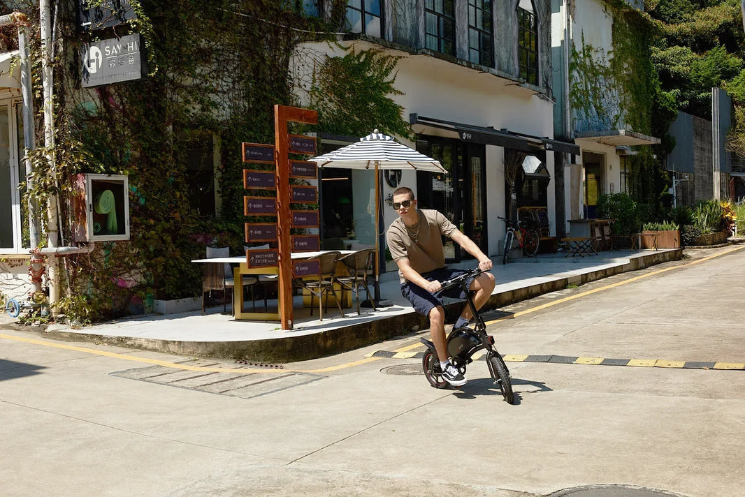 DYU D3F mini e-bike chain care guide on a sunny cafe street