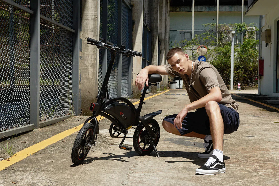 DYU D3F folding e-bike parked on an urban industrial street